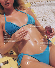Truly Beauty Glazed Donut After Shave Oil Jumbo label close-up shows niacinamide and hyaluronic acid.