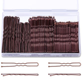 TsMADDTs pin marrón en caja, vista frontal, perfecto para guardar y transportar.