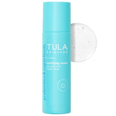 TULA Clarifying Toner bottle pour for clean, refreshed skin preparation.