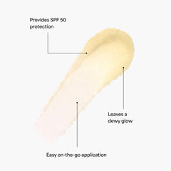 Close-up of TULA Protect + Glow stick gliding on skin for a dewy finish.