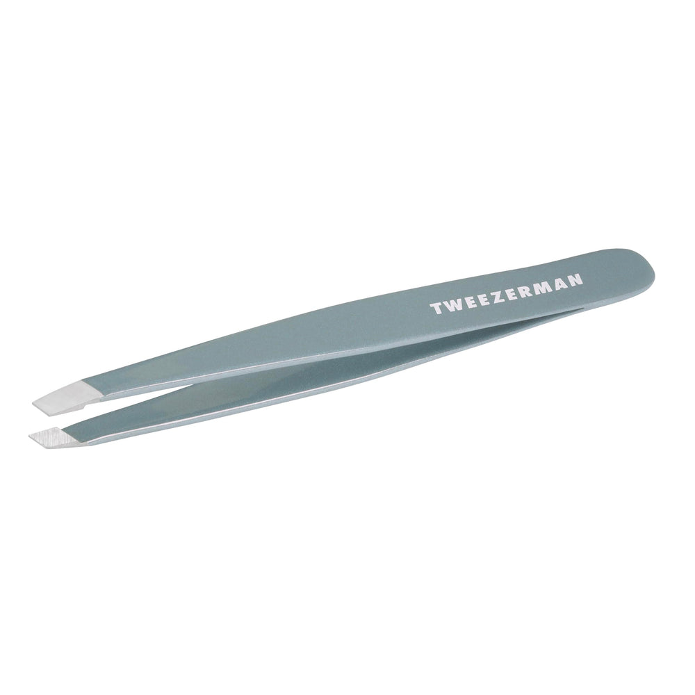 Tweezerman Exclusive Mist Blue Slant Tweezer close up showing precise aligned tips for brow shaping