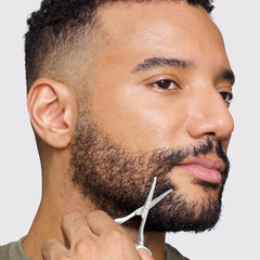 Tweezerman facial hair scissors curved blade for safe, precise nose and ear trimming.