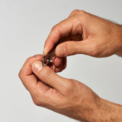 Tweezerman Mini Squeeze Cuticle Nipper handle with textured near-tip grip for control.
