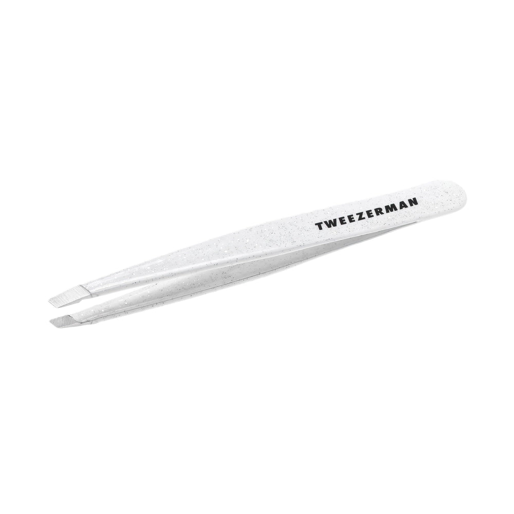 Tweezerman Moon Dust Slant Tweezer close-up with aligned tips for precise brow hair removal.