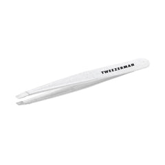 Tweezerman Moon Dust Slant Tweezer close-up with aligned tips for precise brow hair removal.