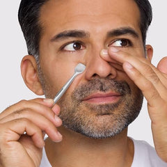 Close-up of Tweezerman Pore Prep Tool removing dirt from pores for clearer skin.