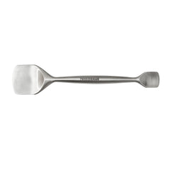 Tweezerman Pore Prep Tool on the forehead with the large end for broad cleansing.