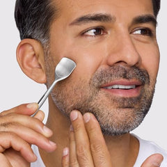 Tweezerman Pore Prep Tool on the nose with the small end for precise pore clearing.