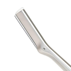 Tweezerman stainless steel facial razor promotes gentle exfoliation for radiant skin.