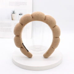TYSSELY spa headband used during cleansing to keep hair dry and out of the way.