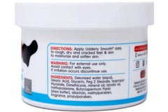 Applying cream to dry feet for daily moisture.
