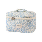 uekeboag large travel quilted makeup bag with floral pattern, ideal for organizing cosmetics on trips.