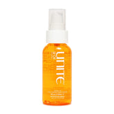 UNITE U Oil bottle in hand for easy application and hydration on hair