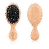 URTHEONE mini boar bristle brush for travel detangles hair gently while distributing scalp oils.