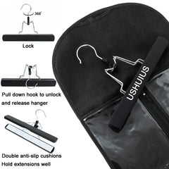 USHUIUS wooden hanger inside bag for secure hair extension handling.
