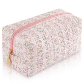 UUYUUY makeup bag with floral quilting in pastel pink, ideal for travel.