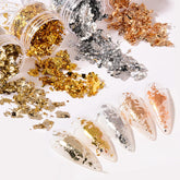 UVANKAUP nail foil flakes gold bottle close-up for shiny nails and crafts.