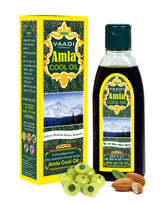 Vaadi Herbals Amla-Brahmi Hair Oil pour for cooling scalp nourishment.