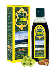 Vaadi Herbals Amla-Brahmi Hair Oil pour for cooling scalp nourishment.