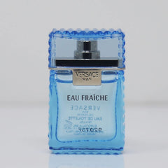 Versace Man Eau Fraiche mini spray bottle in use for casual evening.