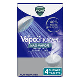 Tableta Vicks VapoShower MAX colocada en el suelo de la ducha para vapores calmantes.