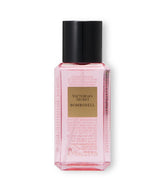 Victoria's Secret Bombshell mini mist bottle pour for a quick fruit-forward refresh.