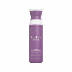 Virtue Flourish Shampoo bottle pours onto hair, purifying the scalp.