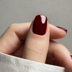 Vishine dark red gelpolish brush stroke showing smooth application and rich pigment.