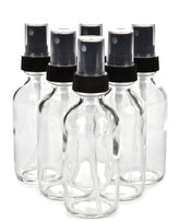 Vivaplex 6-pack 2 oz clear glass bottles with black mist sprayers offer travel convenience.
