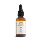 We Love Eyes tea tree eyelid cleansing oil bottle for allergen removal.