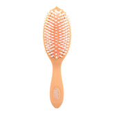 Wet Brush Go Green Coconut Oil brush front view, showcasing plant-based plastic construction for eco-friendly detangling.
