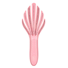 Wet Brush Go Green Curl Detangler in pale pink glides through curls for painless detangling.