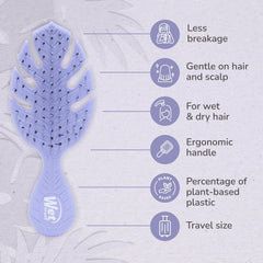 Wet Brush Go Green Mini Detangler Purple held for on-the-go styling and quick detangling.