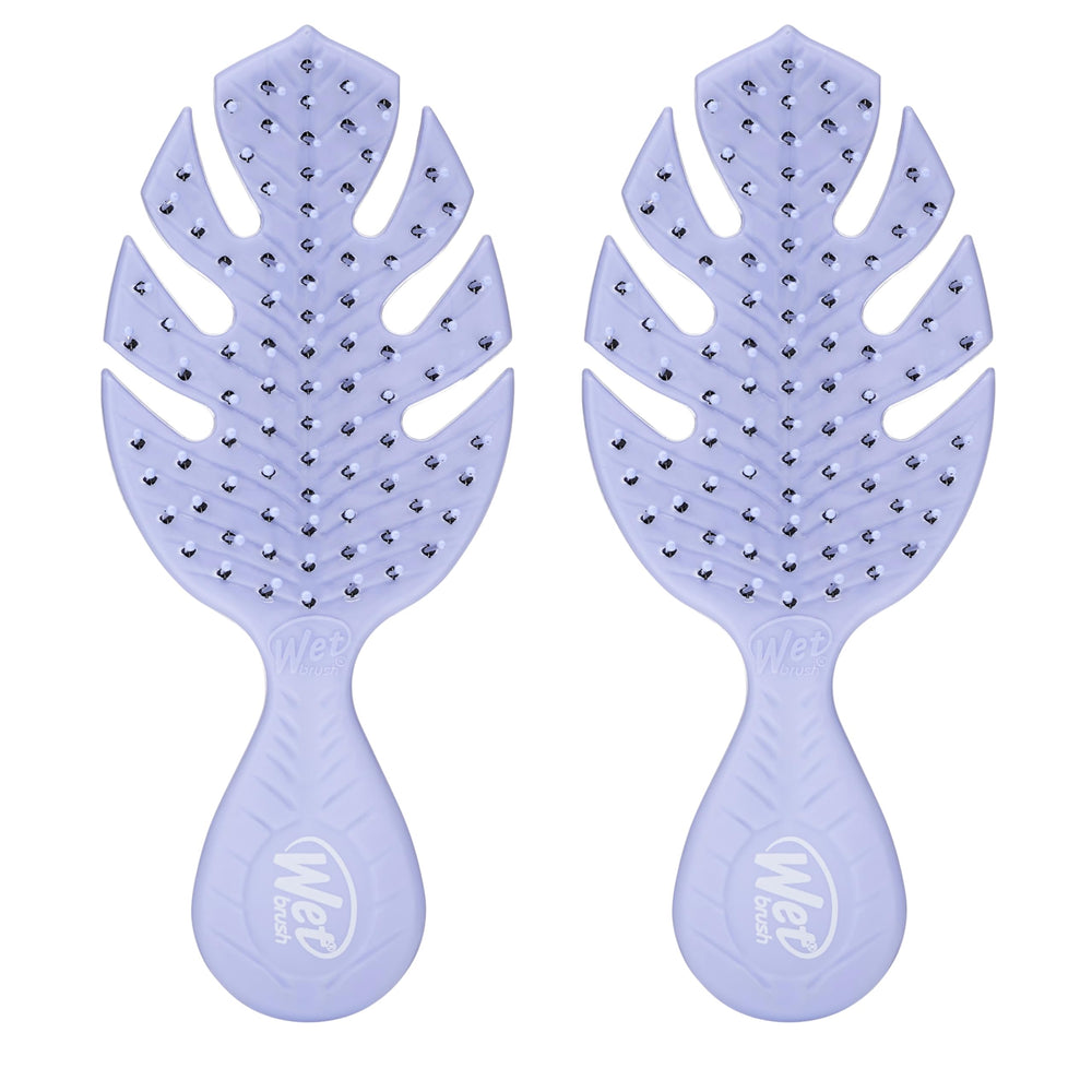 Wet Brush Go Green Mini Detangler Purple packaging highlights plant-based plastic for eco-friendly travel.