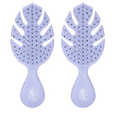 Wet Brush Go Green Mini Detangler Purple packaging highlights plant-based plastic for eco-friendly travel.