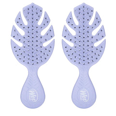 Wet Brush Go Green Mini Detangler Purple packaging highlights plant-based plastic for eco-friendly travel.