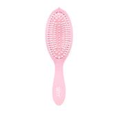 Wet Brush Go Green Watermelon Oil bottle shows the oil-infused treatment for smooth detangling.
