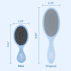 Wet Brush Mini Detangler Sky held in hand for portable grooming