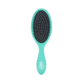 Wet Brush Original Detangler aqua packaging demonstrates effortless detangling for all hair types.