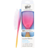 Wet Brush Original Detangler Electric Sky Pink in hand showing gentle detangling