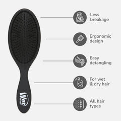 Wet Brush Original Detangler held in hand for easy everyday styling.