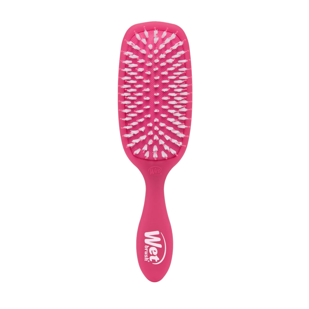 Wet Brush Smooth Styler pink frost close-up shows IntelliFlex bristles gliding through hair for easy detangling.