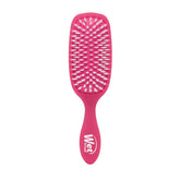 Wet Brush Smooth Styler pink frost close-up shows IntelliFlex bristles gliding through hair for easy detangling.