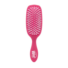Wet Brush Smooth Styler pink frost close-up shows IntelliFlex bristles gliding through hair for easy detangling.