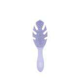 Wet Brush Go Green Detangler Purple close-up gliding through knots