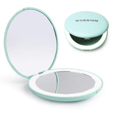 WOBSION LED travel makeup mirror, 3.5-inch round, compact for on-the-go touchups.