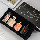 Women's perfume set gift box with four fragrances, ideal for gifting.