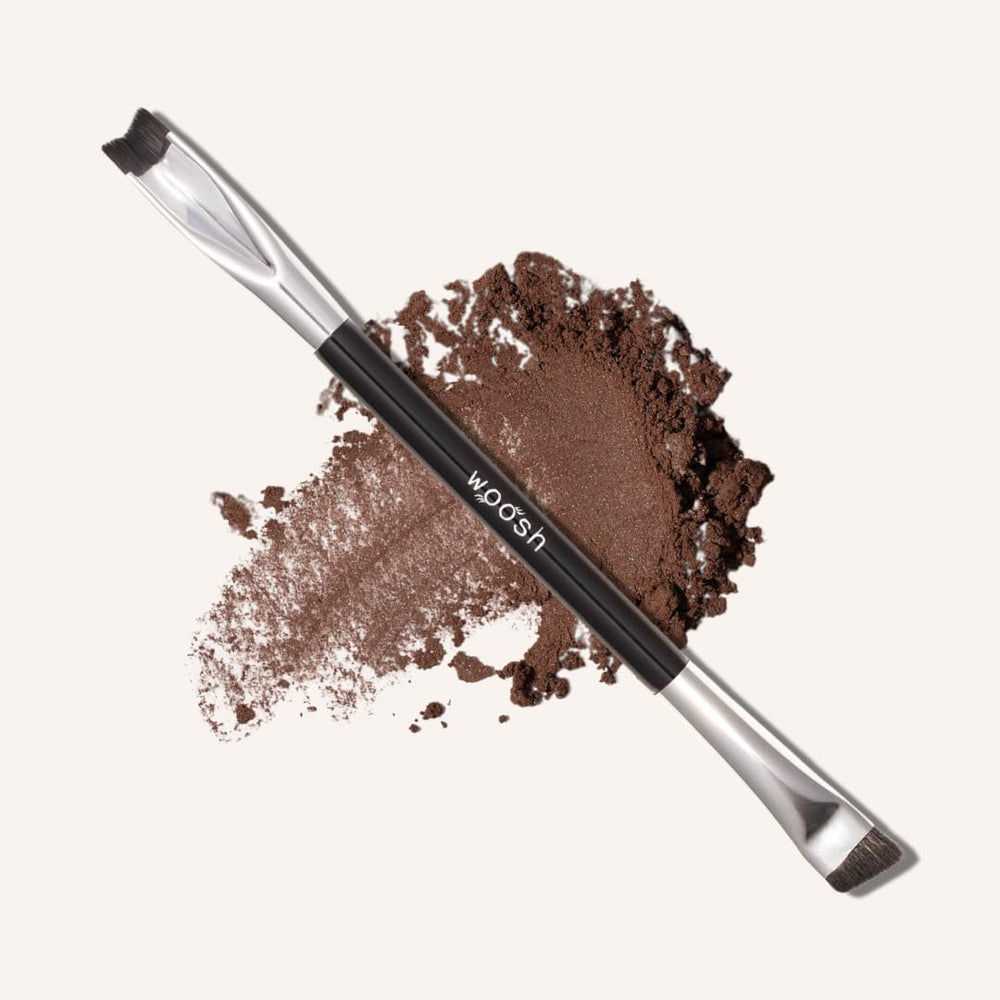 Woosh Corner Brush Eye Stamper with a V-shaped end for precise shadow placement.