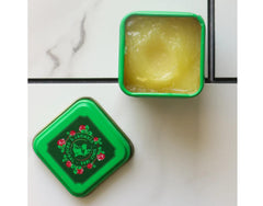 Box packaging showing the 1-ounce size of WPARHUS Bag Balm Lotion.