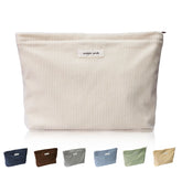 Wudygirl travel makeup bag in beige corduroy exterior offering stylish travel organization